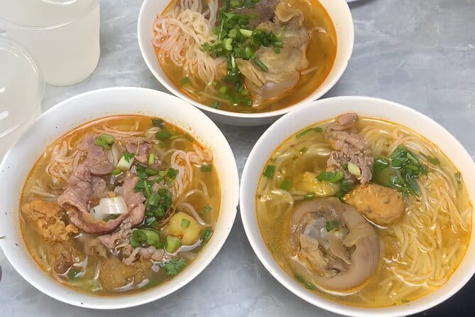 E biking Night Street Food Tour with Local Guide - Riding Hue after dark on an electric bike