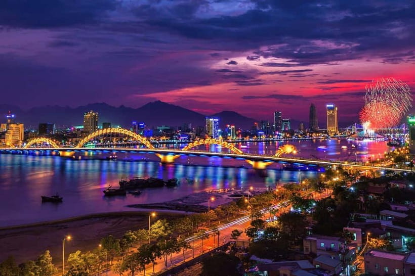 Lively Danang Sightseeing Night Tour with Local Dessert - Dragon Bridge after dark, breeze and golden lights